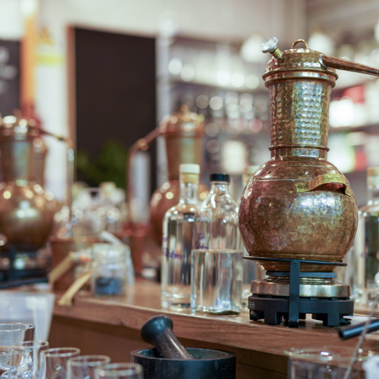 Mini distilling equipment, bottles and glasses