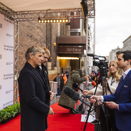 Well known director is interviewed on red carpet for Glasgow Film Festival 