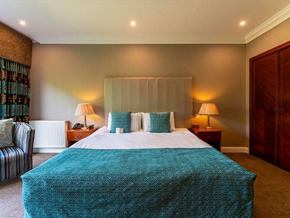 Hotel bedroom with king-size bed 