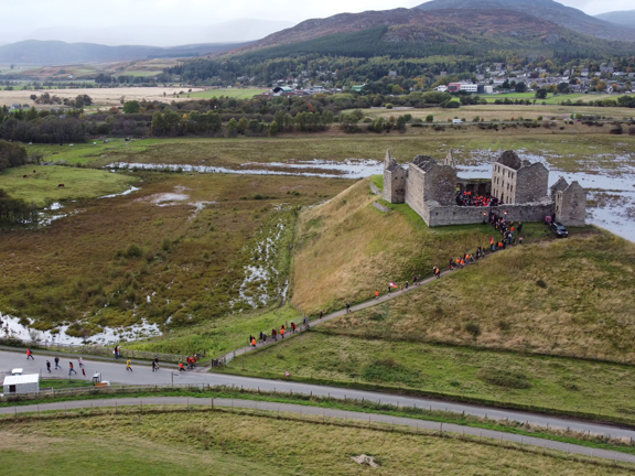 Scottish countryside with a castle sat upon a hill