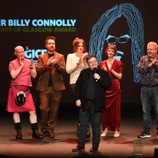 Several comedians stand on stage as they were nominated for the Sir Billy Connelly Spirit of Glasgow Award with the winner Suzie McCabe in the forefront